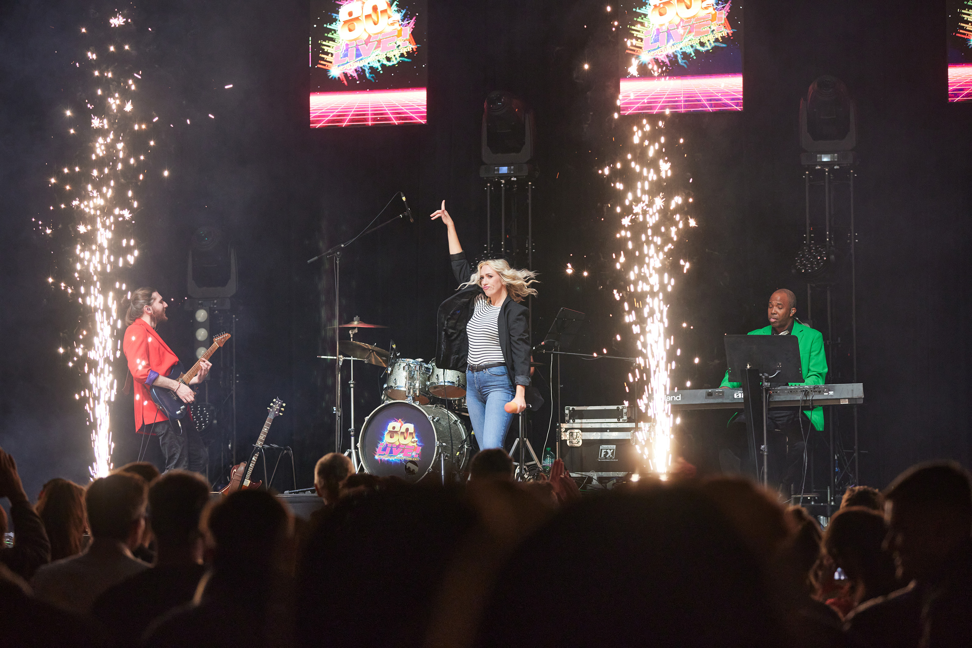 Singers on stage in front of an audience for the theatre show 80s Live coming soon to The Victoria Theatre Halifax