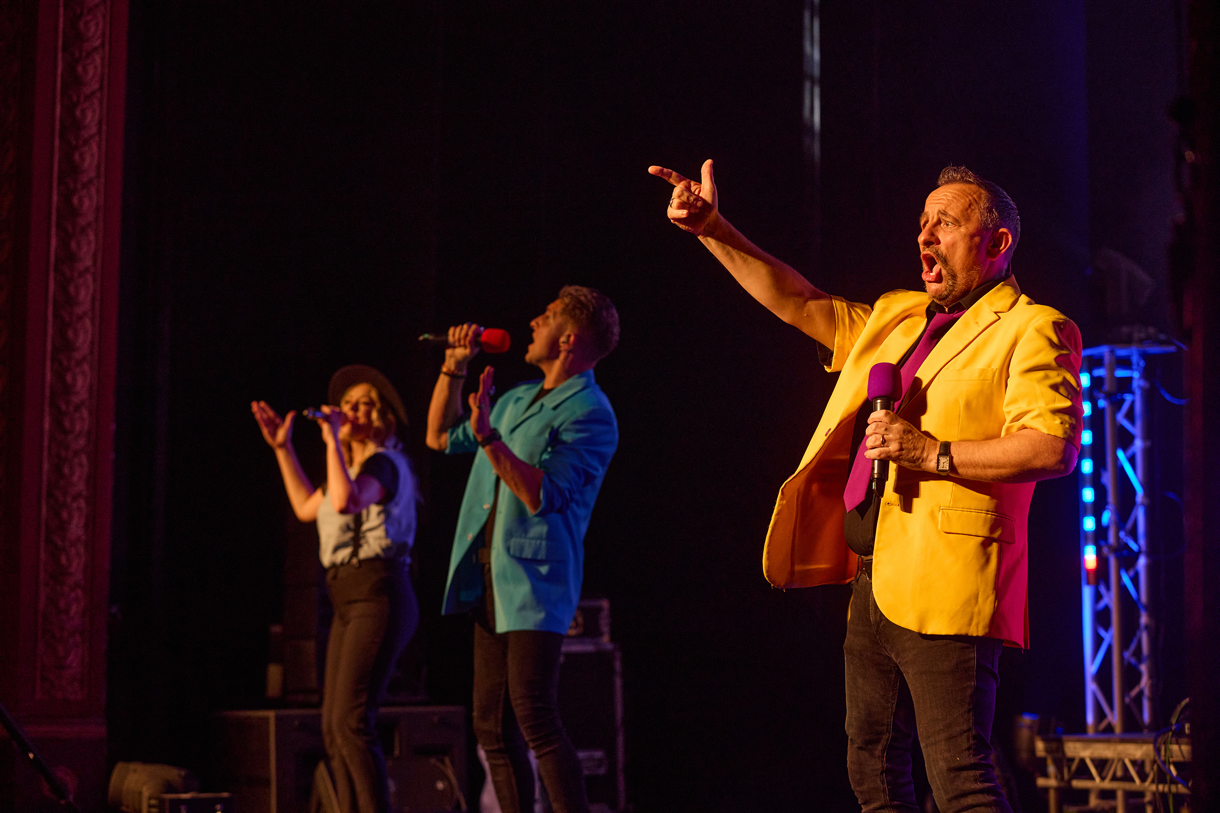 Singers on stage in front of an audience for the theatre show 80s Live coming soon to The Victoria Theatre Halifax