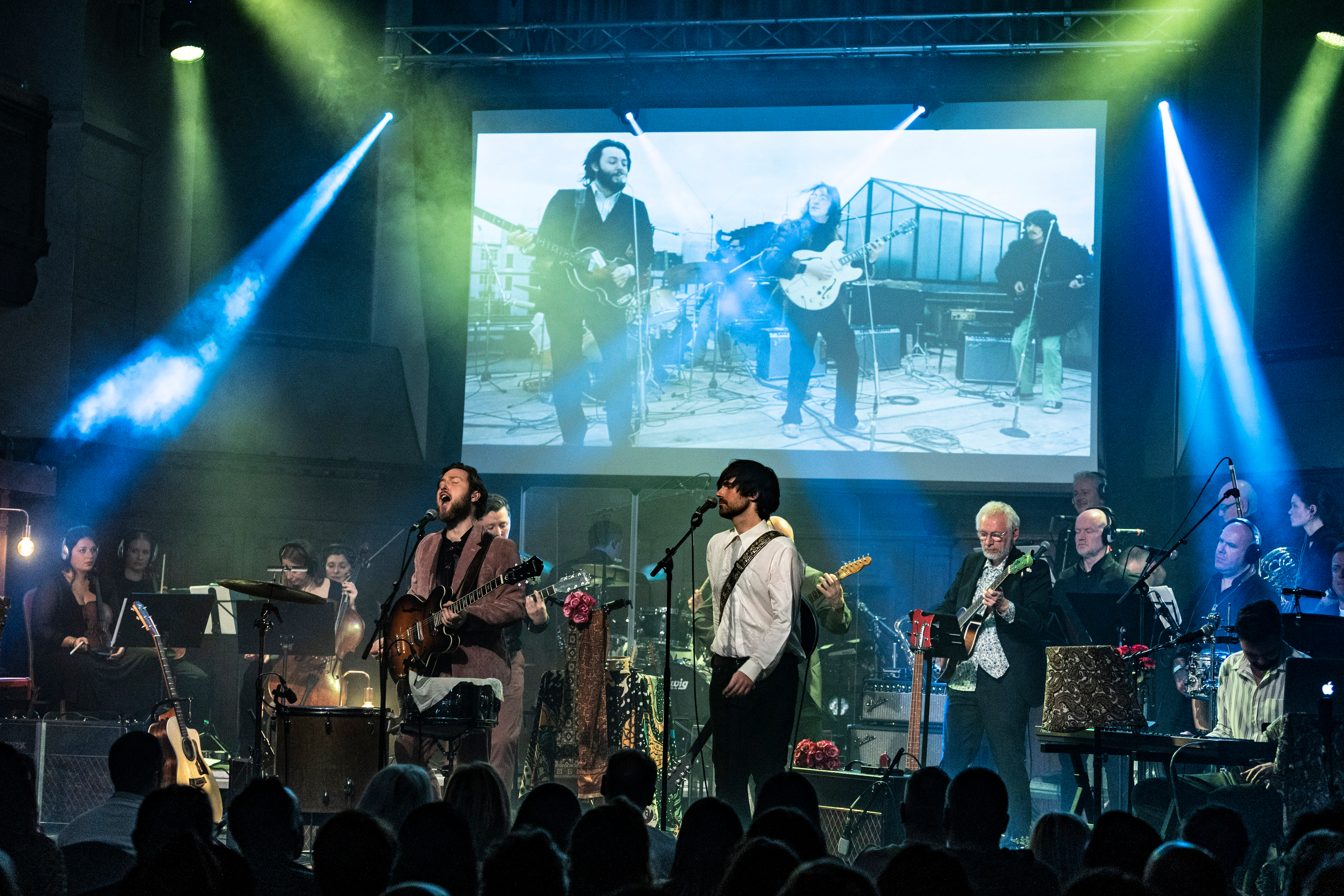 Across The Universe: The Beatles '66-'70 promotional image with band and orchestra at Victoria Theatre Halifax