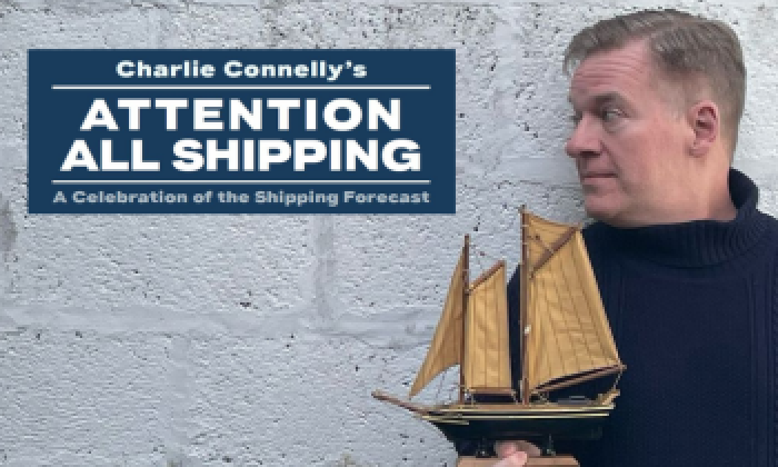 A promotion banner for an event at the Victoria Theatre Halifax featuring Charlie Connelly in a dark coloured jumper holding a small ship against a wall and the name of the show Attention All Shipping on the image