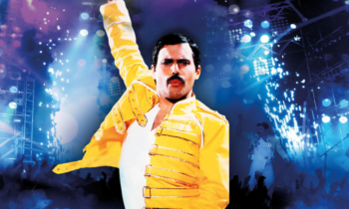 Promotional banner for Killer Queen a tribute to Freddie Mercury and Queen which will be at the Victoria Theatre Halifax in February 2027. The image features the singer dressed in a yellow jacket with a blue background